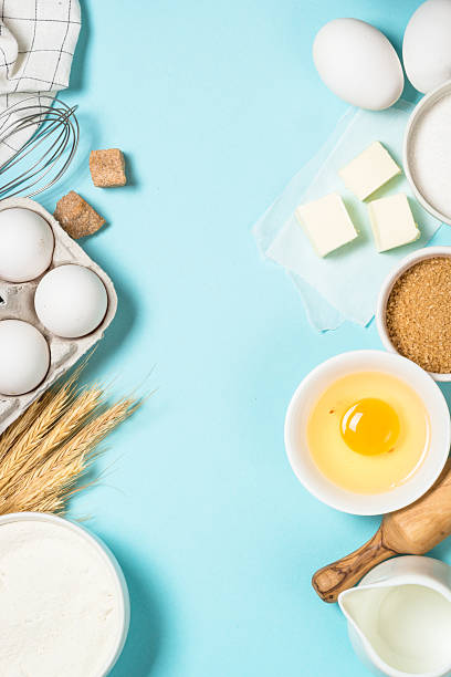 istock Baking background. Food cooking ingredients at blue table top view. 2227763869