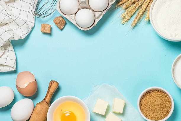 istock Baking background. Food cooking ingredients at blue table top view. 2227763891