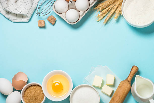 istock Baking background. Food cooking ingredients at blue table top view. 2227763893