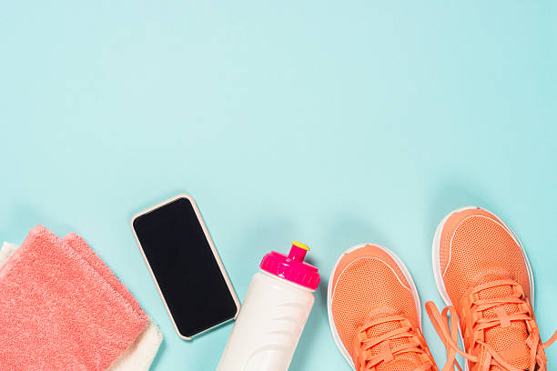istock Fitness equipment at blue background top view. 2227763925