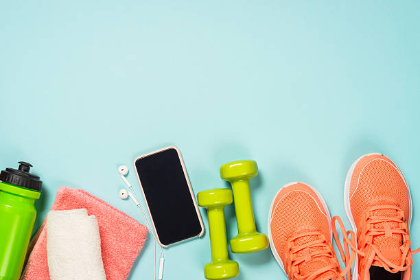 istock Fitness equipment at blue background top view. 2227763931