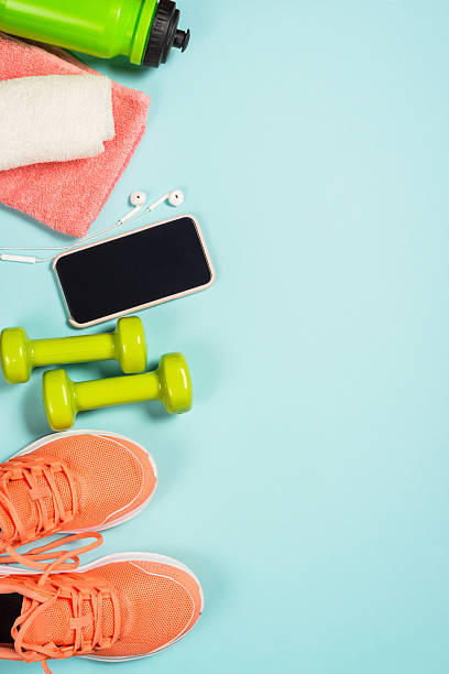 istock Fitness equipment at blue background top view. 2227763937