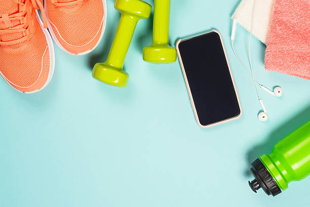 istock Fitness equipment at blue background top view. 2227763940