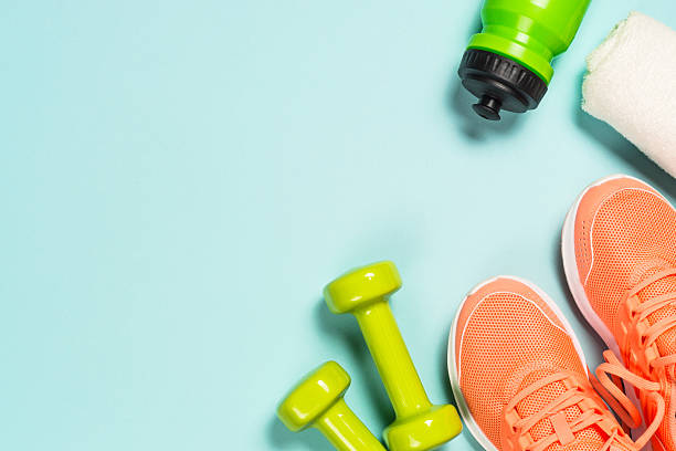 istock Fitness equipment at blue background top view. 2227763946