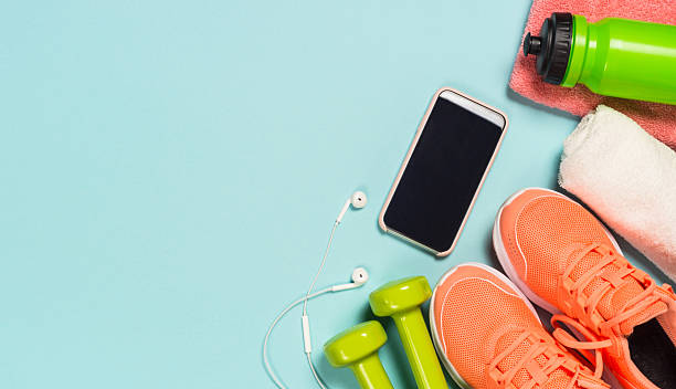 istock Fitness equipment at blue background top view. 2227763961