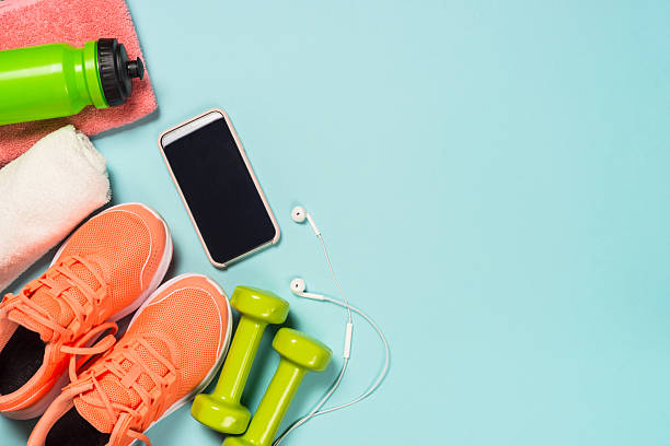 istock Fitness equipment at blue background top view. 2227763962