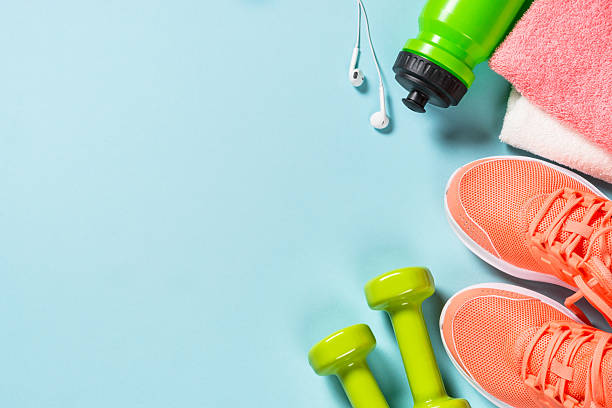 istock Fitness equipment at blue background top view. 2227764098