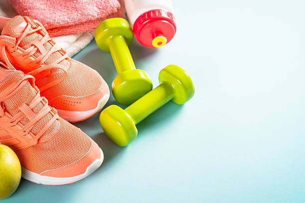 istock Fitness equipment at blue background top view. 2227764114