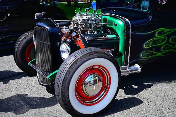 Umea, Norrland Sweden - June 29, 2024: A menacing black hot rod with exposed engine and traditional customization.