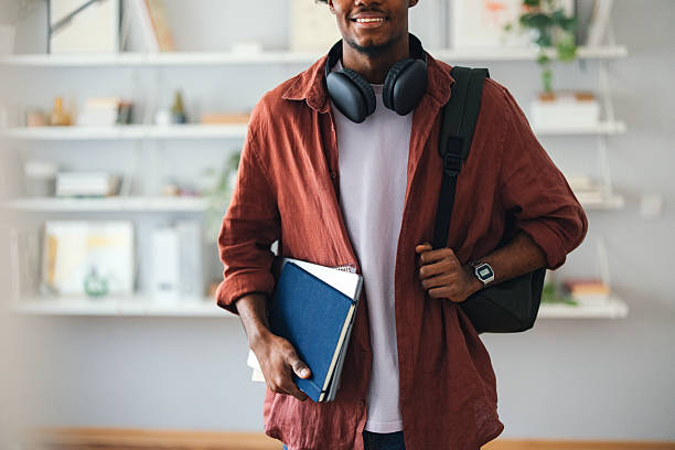 istock Student With Books and Bag Standing in a Cozy Home Study Space 2227767673