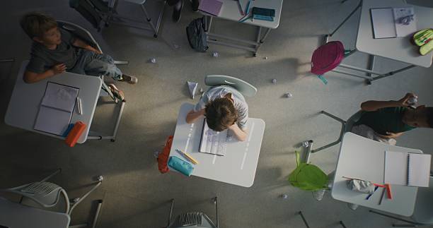 istock Elementary School Student Suffering from Peer Harassment from Classmates in Toxic School Environment 2227768402
