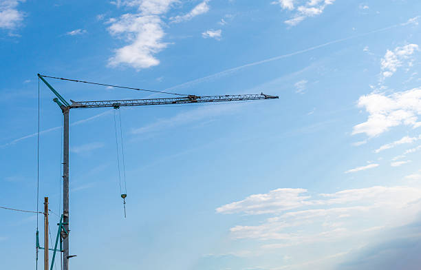 istock Construction tower cranes on a building site in Sottomarina, Italy. 2227773211