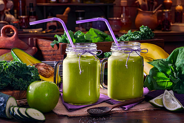 Healthy food: Two green smoothies made with ingredientes such as spinach, avocado and other fruits and vegetables.