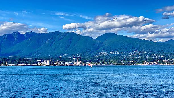 istock Vancouver waterfront and mountain view under blue sky. 2227777379