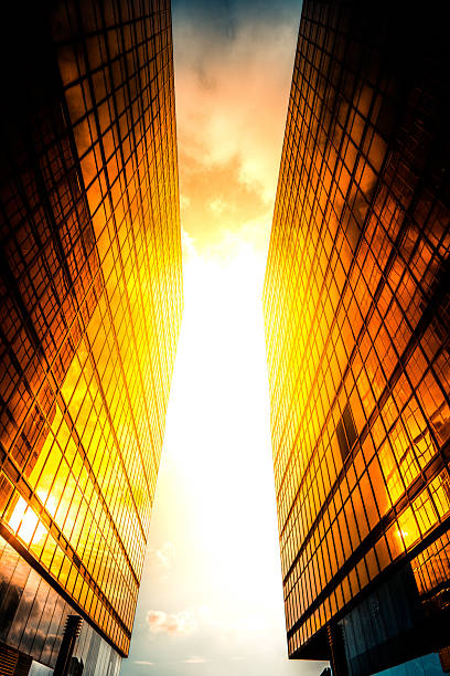 istock Golden skyscrapers reflecting the sunset in a modern metropolis 2227777501