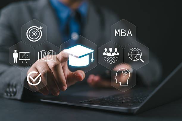 istock MBA, Master of Business Administration program concept. Courses to developing skills in business and management fields. Businessman with laptop touching MBA icon on virtual screen. 2227778767