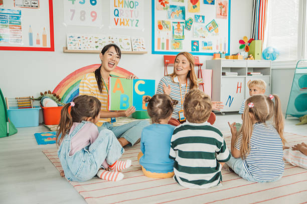 istock Teacher Reading to Daycare Children 2227780994