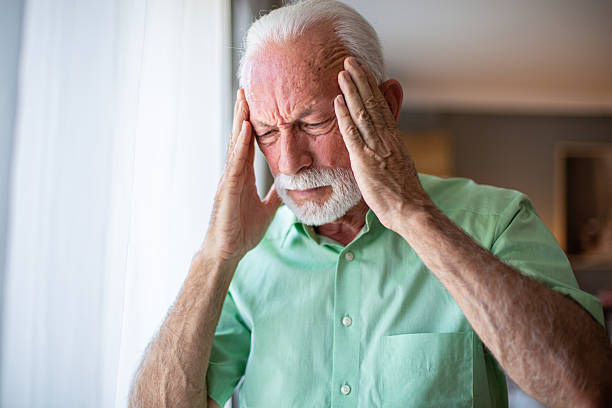 istock Senior man suffering from a strong headache at home 2227783809