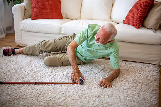 istock Senior man fallen on the floor reaching for his cane 2227784877