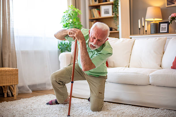 istock Senior man falling down at home while leaning on walking cane 2227784905