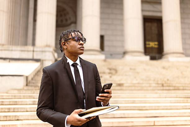 istock Professional Businessman with Smartphone and Documents Outside Government Building 2227785012