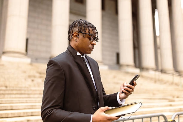 istock Lawyer Checking Smartphone Outside Courthouse 2227785013