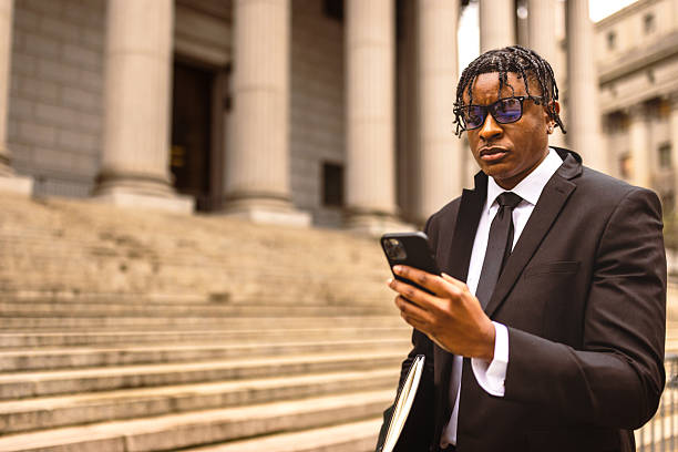 istock Business Professional Using Smartphone Outdoors 2227785018