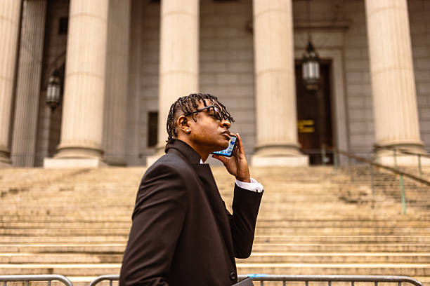 istock Business Professional on Phone Outside Courthouse 2227785023