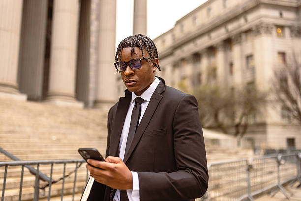 istock Business professional using smartphone outdoors 2227785030