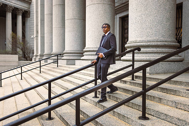 istock Man in Suit Descending Courthouse Steps 2227785033