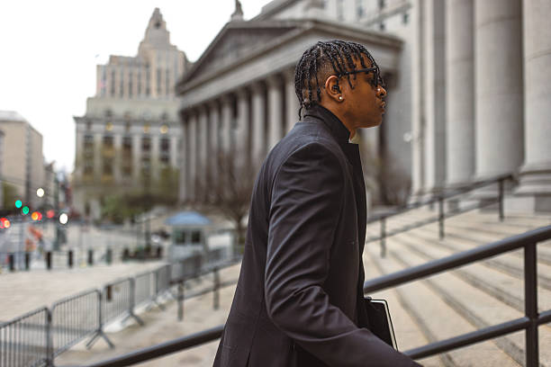 istock Professional Man Walking Up Courthouse Stairs 2227785035