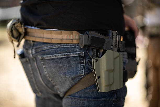 Firearm in Holster on Tactical Belt