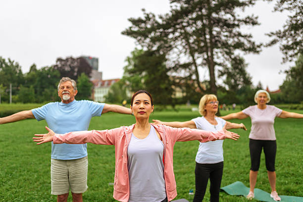 istock Elderly Couples Engage in Outdoor Yoga with Instructor 2227785719