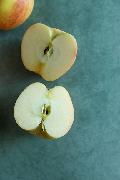 High Angle View Of Apples On Cutting Board