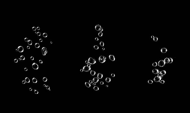istock Water has a black background with bubbles and oil. Abstract underwater background isolated on white and blue water drops as close-up liquid natural shot. Beautiful oxygen bubbles. 2227791152