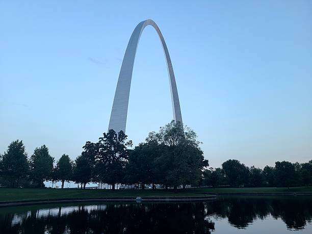 istock The Gateway Arch with Silhouetted Trees and Reflection Pond in the Evening 2227791970