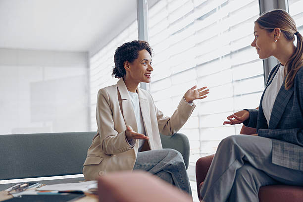 istock Happy diverse women office workers is distracted from work and talking in office during break 2227792381