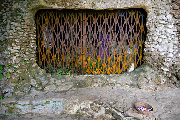 Hanging coffins, graves. Old coffin with skulls and bones nearby on a rock. Traditional burials site, cemetery Kete Kesu in Tana Toraja, South Sulawesi.