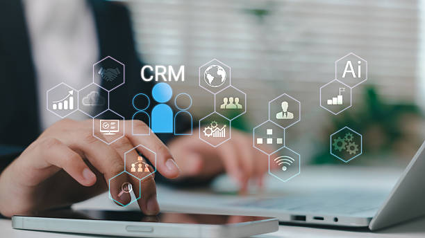 istock Businessman using CRM system with AI-powered tools for customer relationship management, sales analytics, and digital marketing strategy in a modern office environment. 2227797719