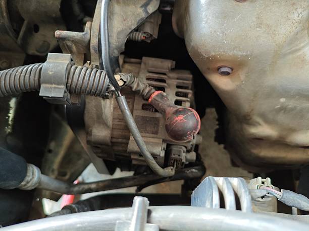 istock Closeup of cables connected to a car alternator 2227797747