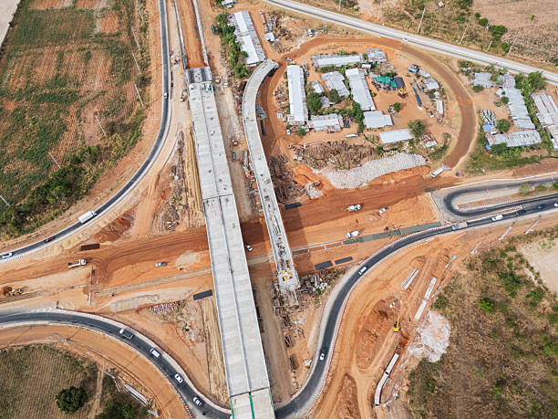 istock The construction site before the construction of the concrete bridge over the intersection by crane workers, tractors, and backhoes 2227798729