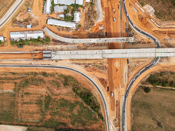 istock The construction site before the construction of the concrete bridge over the intersection by crane workers, tractors, and backhoes 2227798762