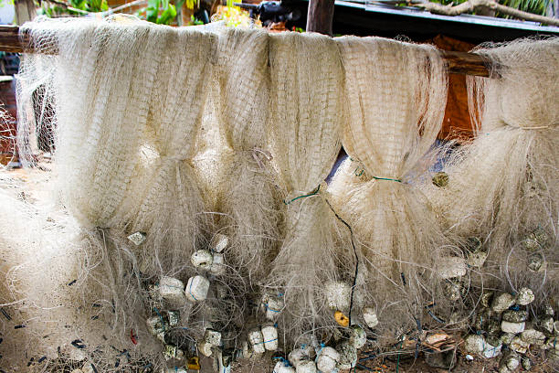 Some nylon fishing nets drying in the sun, with a blurred background, in Tutoia MA, Brazil