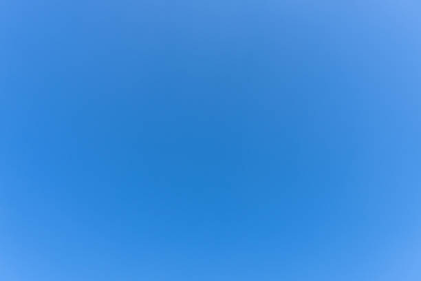 Low angle view and full frame of beautiful light blue sky without clouds in the afternoon on sunny day is used as natural background texture in decorative art work.