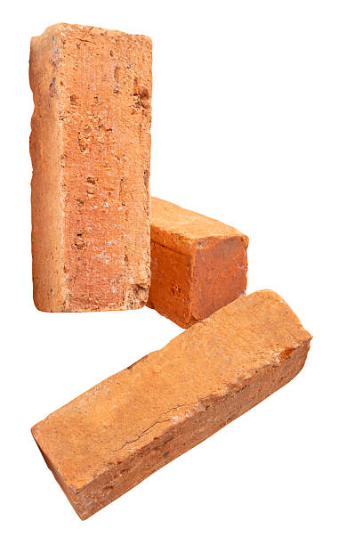 istock Side view of three cracked old red or orange bricks in stack isolated on white background with clipping path 2227803289