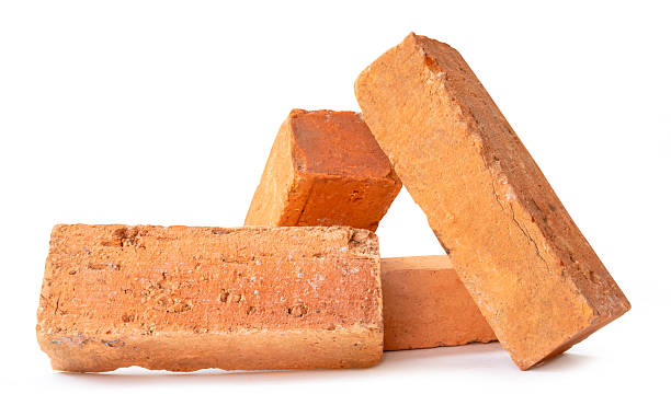 istock Side view of four cracked old red or orange bricks in stack isolated on white background with clipping path 2227803378
