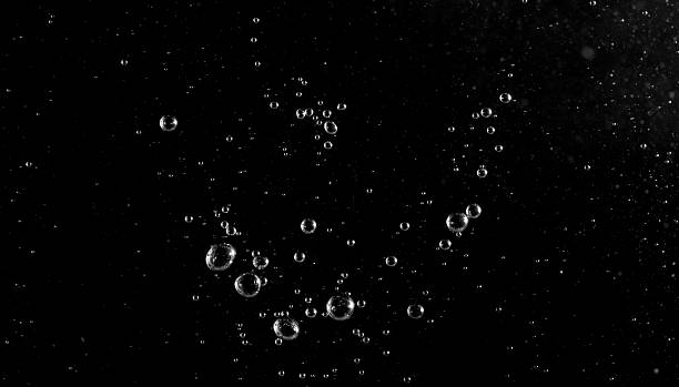 istock Underwater bubbles, Underwater oxygen design concept, Small water drops underwater, On black background, Close-up photography. 2227805688