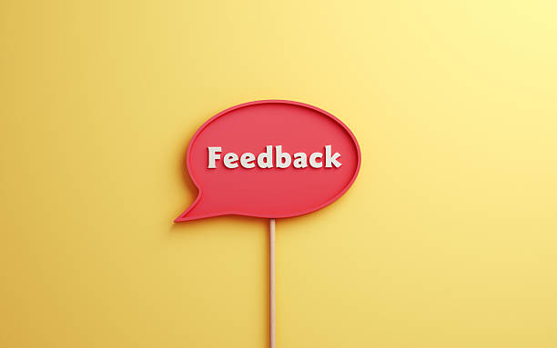 istock Red Feedback Text in White Speech Bubble on Yellow Soft Infinite Background 2227810846