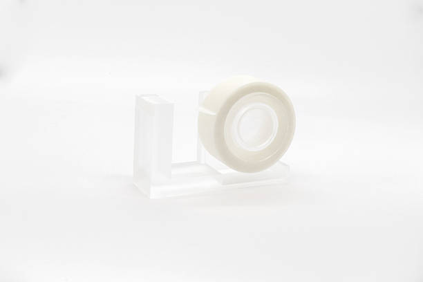 istock blank mockup template with an empty isolated white clean simple round washi tape dispenser and holder on desktop tabletop display background 2227811365