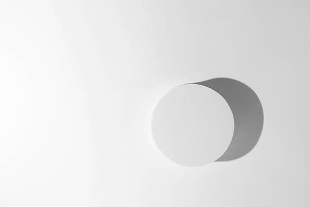 istock empty isolated white clean simple plaster cylinder base and ceramic round circle stand with shadow on desktop tabletop display background 2227811474